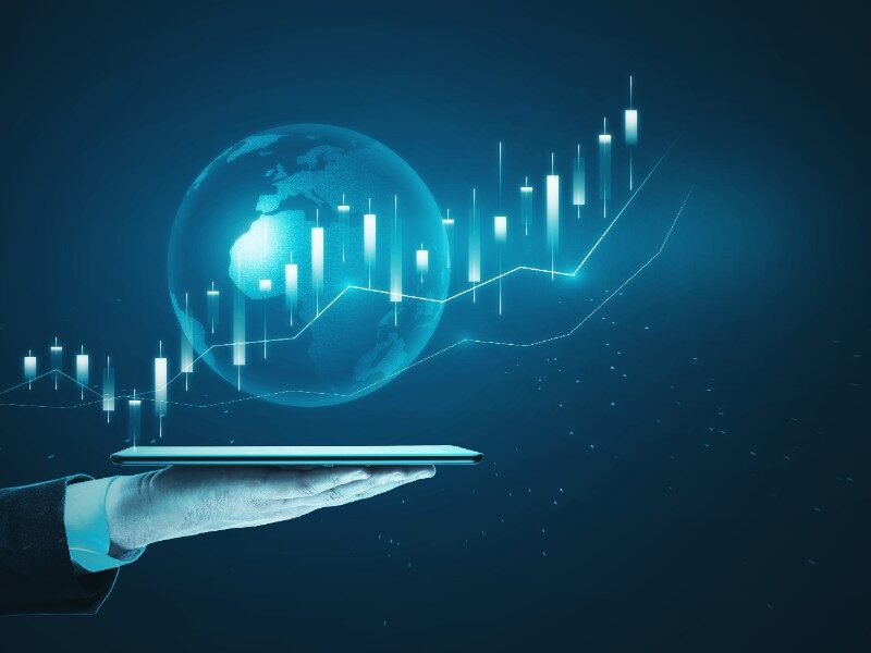 A hand displays the graph